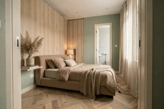 Petite suite parentale 15m2 avec lit en bouclé taupe, panneaux chêne clair et salle de bain attenante en zellige blanc, style chic et épuré 2026